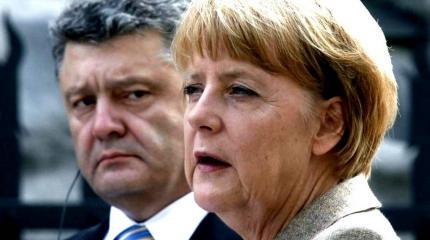 Ангелу Меркель встретили на Украине лозунгом нацистов Ангелу Меркель встретили на Украине лозунгом нацистов
