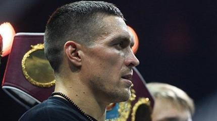 Боксер Усик дал понять националистам, что нападать на церковь не стоит Боксер Усик дал понять националистам, что нападать на церковь не стоит