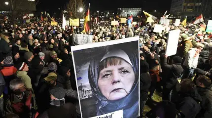 Немцы проклинают Меркель за разгул мигрантов, но считают ее круче Путина Немцы проклинают Меркель за разгул мигрантов, но считают ее круче Путина