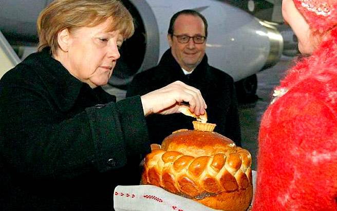 Почему Меркель в Минске встретили хлебом-солью, а Путина — нет?
