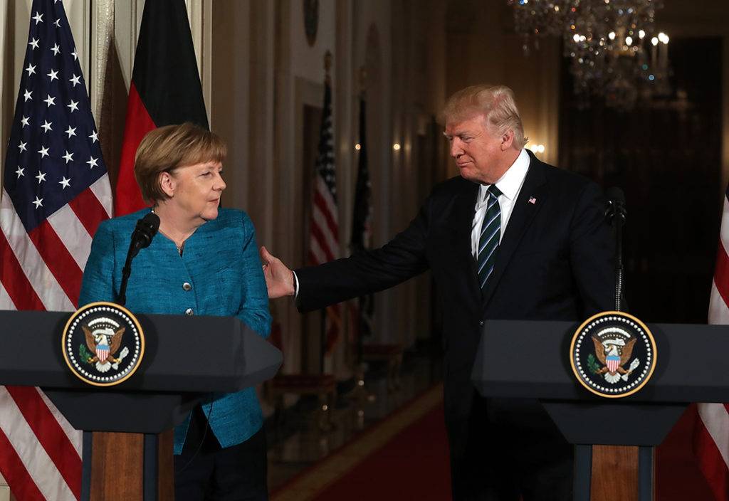 Трамп и Меркель в 2016.